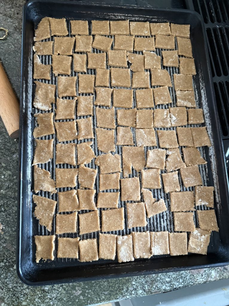 unbaked peanut butter crackers on a large cookie sheet